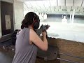 Jess with a 9mm H&K full auto no messin around.