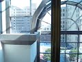 Riding the very nice atrium elevators at the One American Center in Austin, Texas.Atrium elevator specs:General-Otis/Geared Traction.Performance-3500 Lbs/10 HP.Distance-75 feet/6 floors & 350 FPM.Year-Installed/1984.Main elevator specs:General-Otis/Gearless Traction.Performance-3500 Lbs/10 HP.Distance-400 feet/32 floors & 1000 FPM.Year-Installed/1984.