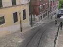 em plena pra�a dos restauradores, lisboa, est� o elevador da gl�ria, inaugurado em 24 de outubro de 1885.

faz o trajecto baixa - bairro alto.

foi constru�do pelo engenheiro portugu�s raoul mesnier du ponsard. come�ou por funcionar com dep�sitos de �gua, que, graviticamente, faziam descer um dos ascensores e subir o outro. depois foi movido a vapor e a partir de 1914, passou a mover-se a energia el�ctrica.

at� finais do s�culo xix, a ilumina��o dentro da cabine era feita com velas, durante as viagens nocturnas.

desde fevereiro de 2002, o elevador est� classificado como monumento nacional.
(wikipedia)


the gl�ria funicular was opened in 1885 and in february 2002 it was classified as a national monument. it was the second of its kind in lisbon, thanks to the initiative of the new lisbon mechanical lift company (nova companhia dos ascensores mec�nicos de lisboa - n.c.a.m.l.). this company specialised in the building and running of urban transport on sloping terrain. the first of its lifts was the lavra, opened the year before.

the story of this lift can be traced back to 1875, when the lisbon city council gave the rights to two individuals to set up a form of transport on sloping terrain in the cal�ada da gl�ria. the construction projects, however, were never approved and time slipped by.

in 1882, the subject was in the air again and the construction rights were awarded at this juncture to an engineer from porto, raoul mesnier de ponsard. he immediately transferred the rights to the n.c.a.m.l.

the carriages were different from anything that lisbon had ever seen. they had two floors, the lower one with benches along the sides, the backs towards the street and the upper one also with two benches laid out lengthwise but back to back so that the passengers looked out at the walls of the nearby buildings. access to the top floor was by spiral staircase on the platform which was at the upper end of the carriage.

traction was with rack and cable, with water as the counterweight, and the carriages were connected by a cable so that they counterbalanced each other. they had water tanks on board, which emptied when they reached the restauradores square and filled when they were at the top, in the rua da miseric�rdia. the difference in weight made the system work. close to the internal rails along the length of the route there was a rack where the cogs of the wheels fitted. these cogs were connected to the axis, allowing the brake operator to change the speed of the carriage.

each carriage had a clamp which was connected to the cable and a powerful brake which gripped the two internal wheels by means of a pad, a system which is still in use today. apart from this, there was another brake which worked by pressure on the rails. each carriage weighed about 10 tons and ran on two 25 horsepower electric engines working jointly.

the carriages could only start if both brake operators worked together but it only needed one operator to stop them. the electric current was transmitted by a pantograph on the roof. the bodywork was also different from previously. the carriages were made of wood, painted the colour of mahogany and the windows had iron bars to stop the passengers from leaning out. there were two benches placed lengthwise and between 20 and 22 passengers could be carried at any one time.

in september 1915, the cal�ada da gl�ria was electrified and came back into service

some years later, in 1926 to be precise, the n.c.a.m.l. was wound up and carris acquired the operating concession, along with all the rolling stock and fixtures. the first thing that the new owner did was to build a shelter for passengers, in restauradores square. many people voiced their disapproval of this, especially in the media, and it did not in fact last for very long. the shelter was opened on 4 november 1927 and it saw its last days in 1934.

it was also in the thirties that the carriages were painted yellow, this being the standard colour which was used by carris and still is.

http://www.carris.pt/en/index.php?area=servicos&subarea=servicos_ascensores_gloria

valpard films http://valpardfilms.awardspace.com/