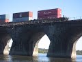 September 23, 2007: NS 26T, 22W, and I1T cross the historical Rockville Bridge within minutes of each other.  NS 26T with NS 9403 and NS 9614 heads right across into the terminal. Next up is NS 22W with NS 9876, NS SD70 2531, and NS ES40DC 7594 has to make a stop at CP Rockville to let I1T westbound before 22W can make it down the singal track to Rutherford terminal on the east side of Harrisburg.  I1T heads westbound with NS 9774 and NS ES40DC 7644.CP Rockville is on the east side of the bridge and CP Mary is on the west side of the bridge. A dragging equipment detector can be heard at MP 111 in Marysville.  The Harrisburg Line will begin on the otherside of the bridge east of the terminal, and the Buffalo Line begins north at CP Wye on the east side of the bridge.  CP rockville makes the south interlocking of the wye, CP Wye is the north.