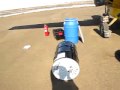 Unloading a 55 gallon drum from a Cessna 208 in Atqasuk, Alaska