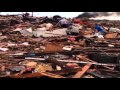 Raw: Walking in a Flattened Okla. Neighborhood