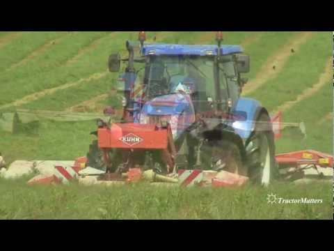 T7060 - new holland t7060 operating a kuhn mower.
