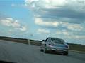 driving around the track in a cayman