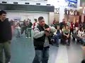 Drunk guy surrounded by people freestyling and dancing