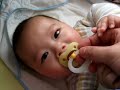 Jayson playing with pacifier