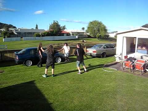 Four Grown Men Jump Through A Hula Hoop