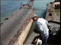 In 1997 these two O class submarines were rotting in Harry pounds Scrapyard. He kindly let us look around them. The Subs and the scrapyard are now long gone.
