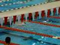 Nick Brunelli swimming in the 100 Breast prelims at AmSCC's
