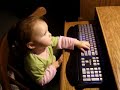 Baby watches Barney on YouTube.