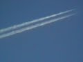 UFO captured in proximity of a jet trail