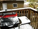 Clearing snow off the BBQ