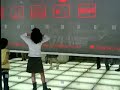 Kids playing w/ panel game in Tokyo