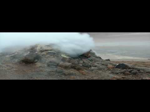 fumarole - May 17, 2010 - Genji stands dangerously close to a steaming, stinking fumarole at the Hverir geothermal field in northern Iceland. It was like being on the M...