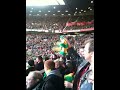 Anti Glazer Green & Gold scarf waving at Old Trafford