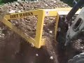Carry all leveler for skid steer loaders