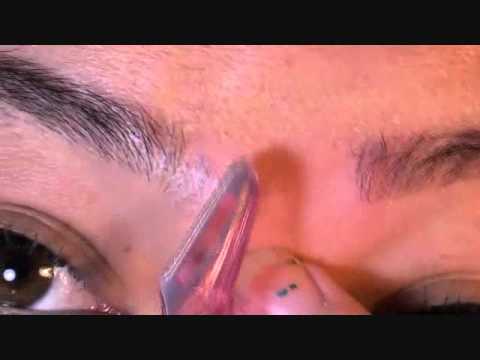 how to trim eyebrows using blade