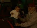taylor riding a pony with granda bill at the state fair!