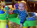 Liam playing with his activity center