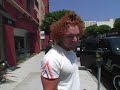 Friendly comedian Carrot Top stops to chat to the paps as he