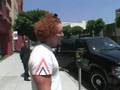 Friendly comedian Carrot Top stops to chat to the paps as he