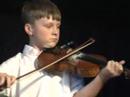 douglas cameron on fiddle, accompanied by dad, lawrence on piano, performing a medley of tunes at the 2007 festival of cape breton fiddling, gaelic college, cape breton, nova scotia, august 2007.