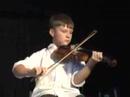 douglas cameron on fiddle, accompanied by dad, lawrence on piano, performing a medley of tunes at the 2007 festival of cape breton fiddling, gaelic college, cape breton, nova scotia, august 2007.