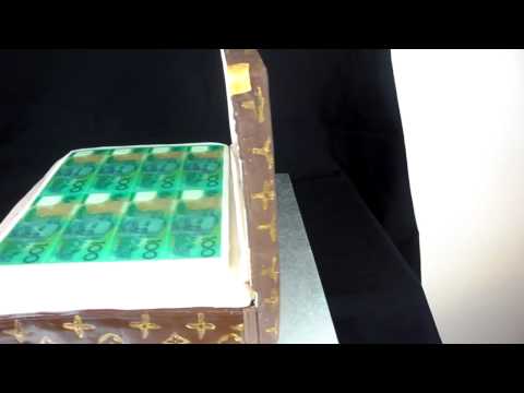 fondant suitcase cake - This cake is a birthday cake made with LV stamp (hand made) on fondant and gum paste cake, hope you like it.