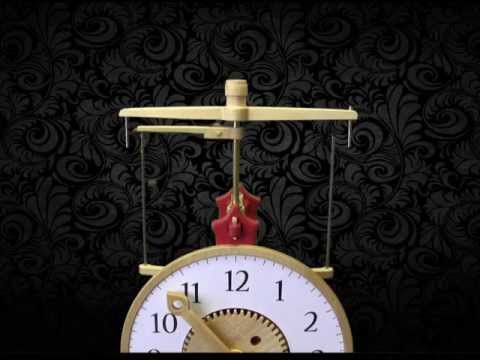 Brian Law - Clock 17 The flying pendulum clock is a clock that uses a flying pendulum escapement mechanism. A small metal ball, connected by string wraps around one stee...