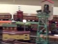 richard's 1926 american flyer president's special passenger set circles the outer loop of standard gauge as rob's katsumi interurbans take the o gauge track on the inside. mighty fine!