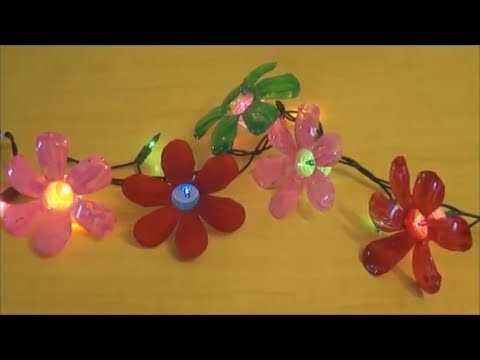 Flowers - This tutorial shows how to make beautiful and colorful flowers out of recycled plastic water bottles. if you paint only at the back side of the flower, it wi...