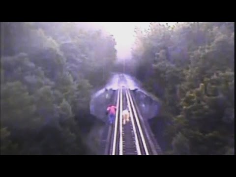 DRAMATIC: Two women narrowly escape death on railroad tracks