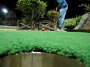 Dad sinks a mini-putt