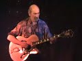 alain giroux plays slide guitar on tour in spain.