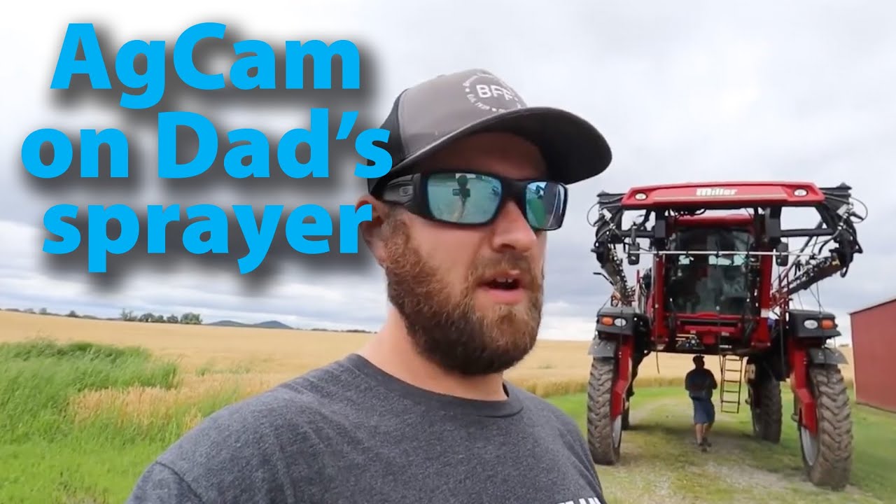 Brian Brown installing an AgCam camera system on his dad's sprayer