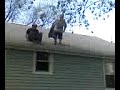 Drew jumping off roof with a boogieboard