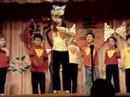 Charlotte and her fellow Mandarin-immersion program kindergartners performing a song in Chinese.  Charlotte is throwing herself into the part of the Angry Wolf...