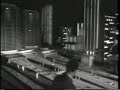 Silent behind-the-scenes footage showing workmen assembling the General Motors Futurama ride for the 1964 - 65 New York World's Fair