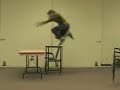 Guy tries to jump chair