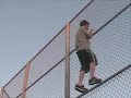Justin Climbing A Big Fence Justin Climbing A Big Fence
