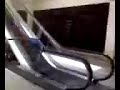 nic sliding down a escalator