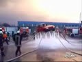 Firemen Lift Car With Hose Water