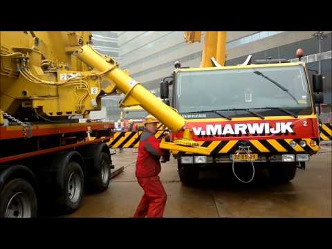 van Marwijk - Building a WT 650 in Den Haag at Central station with 182 tons of counterwaits, 66 meter luffingjib and YSL.