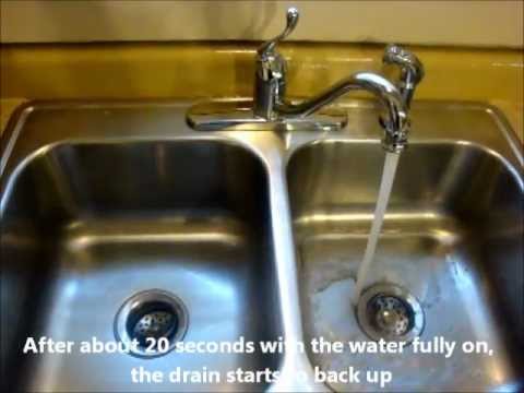 how to fix a slow draining kitchen sink