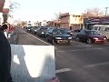 Some guy flipping off the protesters 2002