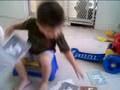 Gabriel shows his flash cards with letters