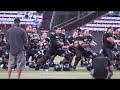 the university of hawaii doing the haka during a pre-game warmup.