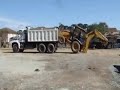 Loading up a backhoe - This Guy is Good!