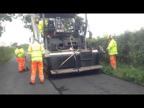 Machine Laying Asphalt 1