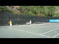 Booie playing with Roger Federer